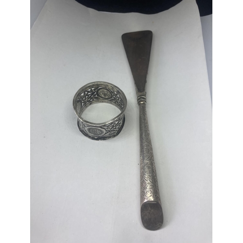 481 - A HALLMARKED BIRMINGHAM SILVER HANDLED SHOE HORN AND AN ORIENTAL SILVER NAPKIN RING