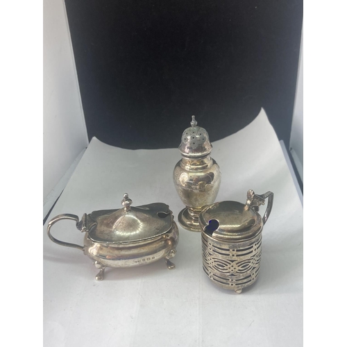 489 - TWO HALLMARKED SILVER POTS (ONE WITH BLUE GLASS LINER) AND A HALLMARKED LONDON PEPPER POT GROSS WEIG... 