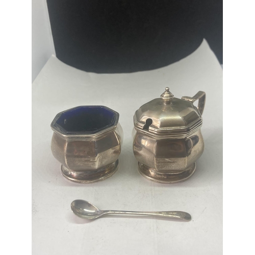 496 - THREE HALLMARKED BIRMINGHAM SILVER ITEMS TO INCLUDE TWO CRUETS WITH BLUE GLASS LINERS AND A SPOON GR... 