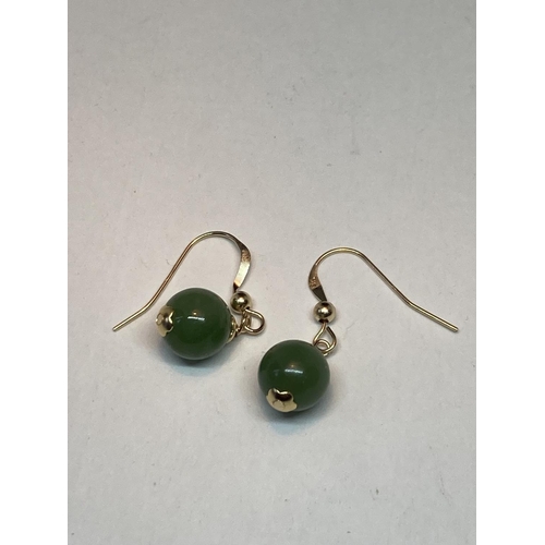 509 - A PAIR OF MARKED 9K EARRINGS WITH GREEN CHALCEDONY STONES