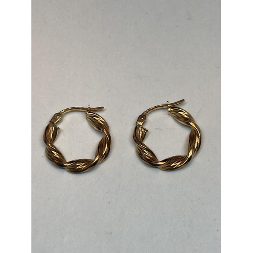 512 - A PAIR OF 9 CARAT GOLD TWISTED HOOP EARRINGS GROSS WEIGHT 1.21 GRAMS