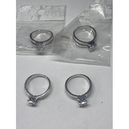 582A - FOUR MARKED S925 RINGS WITH CLEAR STONES