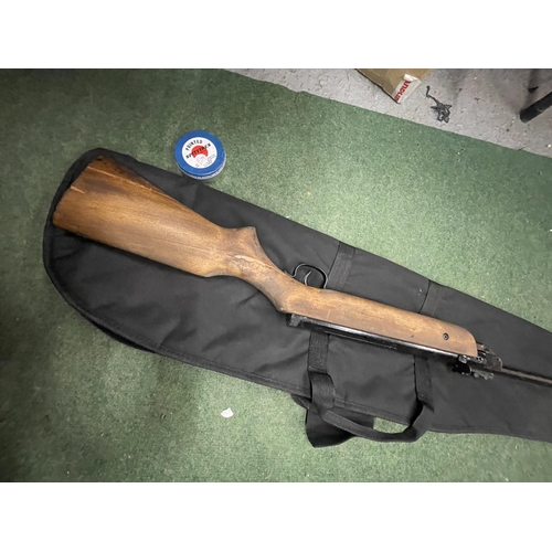 60 - AN AIR RIFLE WITH PELLETS AND A CARRY CASE