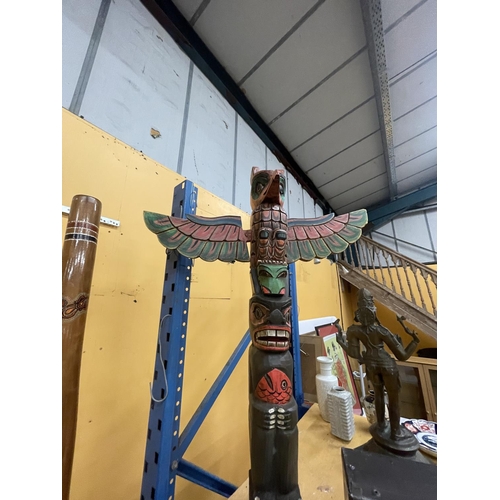 66 - A CARVED WOODEN TOTEM POLE