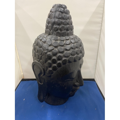 72 - A LARGE CARVED BUDDHA HEAD 34CM TALL