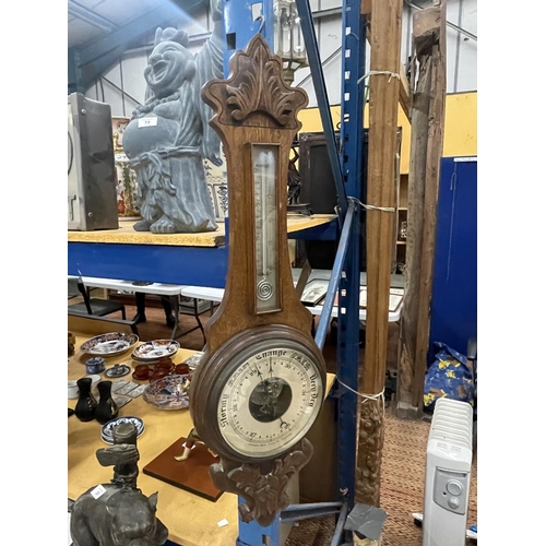 80 - A VINTAGE CARVED BAROMETER WITH A CASED THERMOMETER