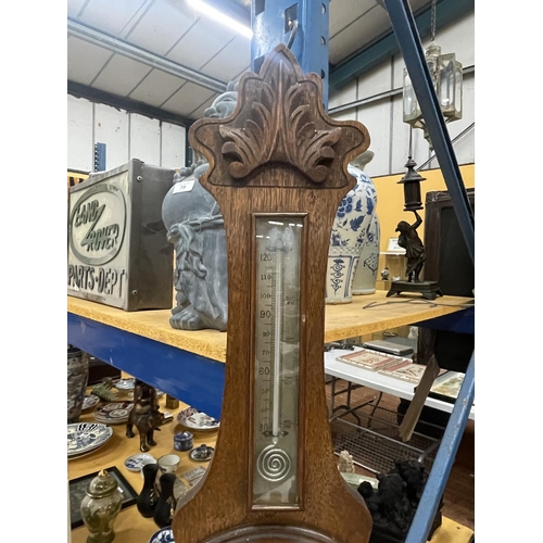 80 - A VINTAGE CARVED BAROMETER WITH A CASED THERMOMETER