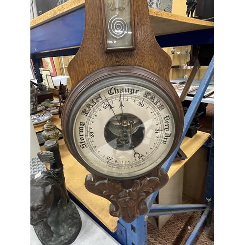 80 - A VINTAGE CARVED BAROMETER WITH A CASED THERMOMETER