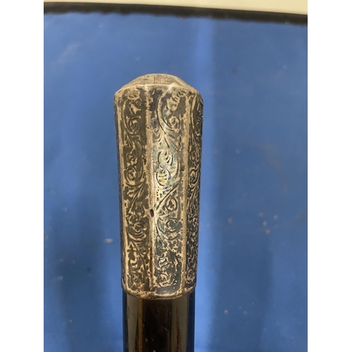 85 - A WALKING CANE WITH A HALLMARKED LONDON SILVER TOP