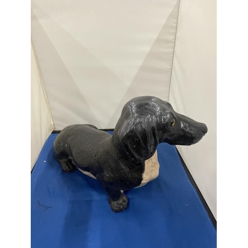 85A - A LARGE FIGURE OF A DACHSHUND APPROXIMATELY 36CM IN LENGTH