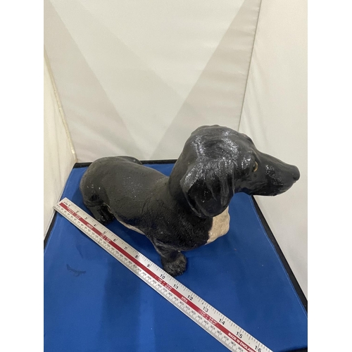 85A - A LARGE FIGURE OF A DACHSHUND APPROXIMATELY 36CM IN LENGTH