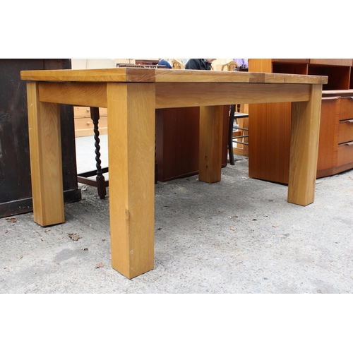 3127 - A MODERN OAK EXTENDING DINING TABLE 55