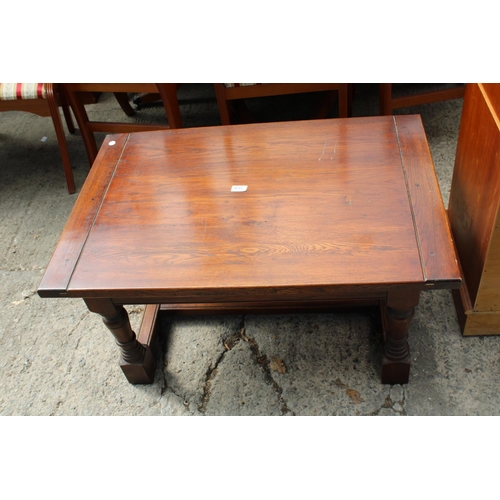 3130 - AN OAK COFFEE TABLE ON TURNED LEGS (36