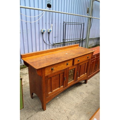 3132 - AN ART NOUVEAU OAK SIDEBOARD WITH CENTRAL EMBOSSED COPPER PANEL - 66