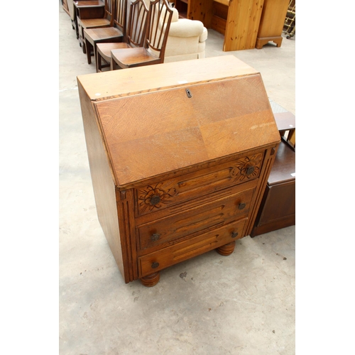 3141 - A MID 20TH CENTURY OAK BUREAU - 30