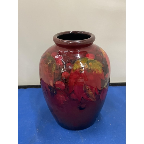 23 - A MOORCROFT FLAMBE LEAF AND BERRY DESIGN VASE