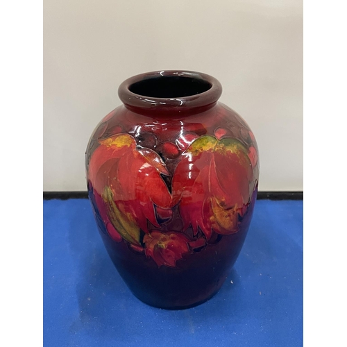 23 - A MOORCROFT FLAMBE LEAF AND BERRY DESIGN VASE