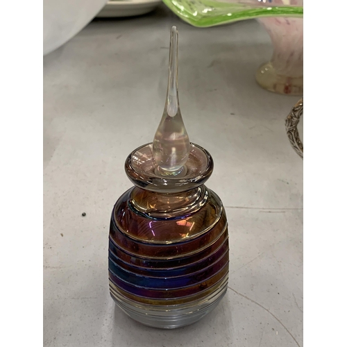 106 - A VINTAGE GLASS ART IRIDESCENT SPUN THREADED PERFUME BOTTLE