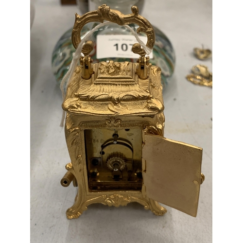 108 - A MINIATURE GILDED FRENCH CLOCK WITH KEY HEIGHT 3.5