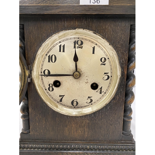 136 - A WOODEN MANTLE CLOCK WITH BARLEY TWIST DESIGN