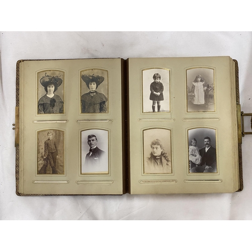 139 - A VICTORIAN LEATHERBOUND PHOTO ALBUM CONTAINING PHOTO'S