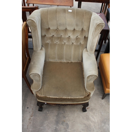 2858 - A GEORGIAN STYLE WINGED EASY CHAIR ON CABRIOLE LEGS WITH BALL AND CLAW FEET