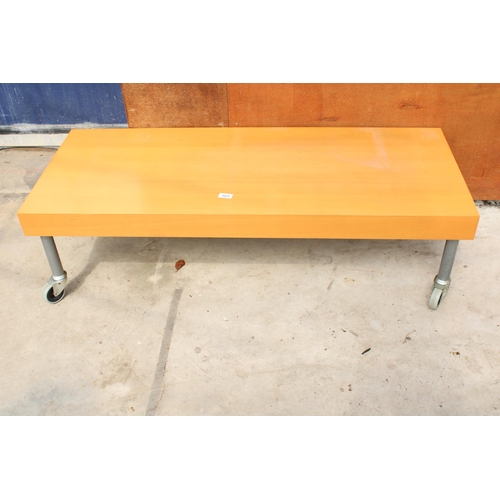 3023 - A MODERN COFFEE TABLE ON CASTERS, 49