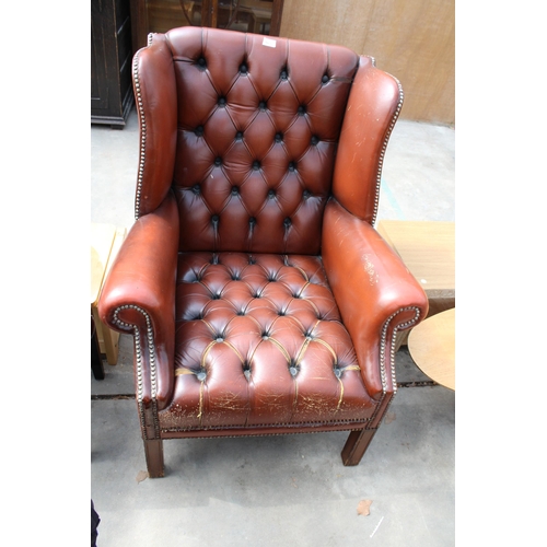 3036 - A MODERN BROWN BUTTON-BACK WINGED FIRESIDE CHAIR