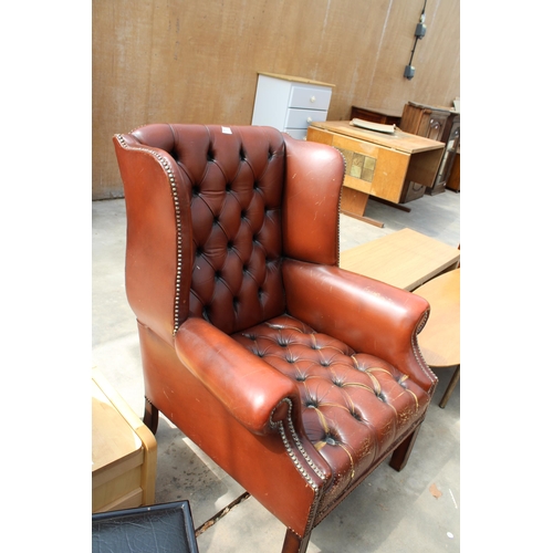 3036 - A MODERN BROWN BUTTON-BACK WINGED FIRESIDE CHAIR