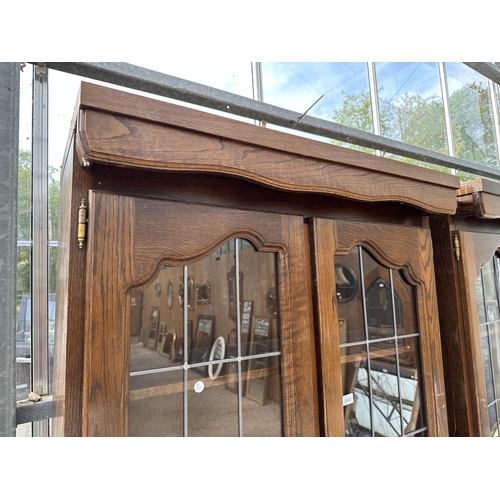 3063 - AN OAK CABINET WITH GLAZED AND LEADED UPPER PORTION, 37