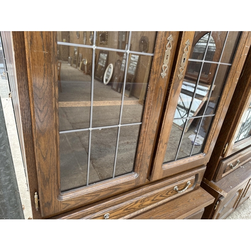 3063 - AN OAK CABINET WITH GLAZED AND LEADED UPPER PORTION, 37