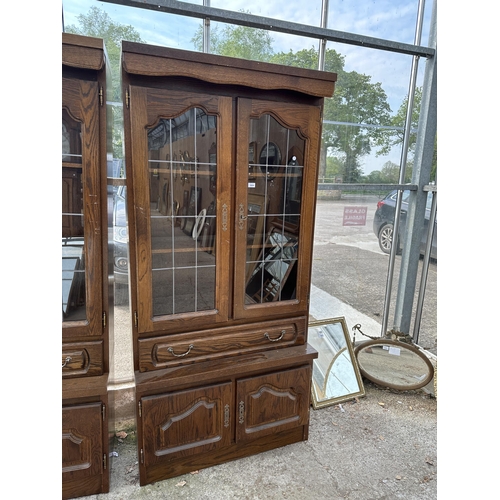 3064 - AN OAK CABINET WITH GLAZED AND LEADED UPPER PORTION, 37