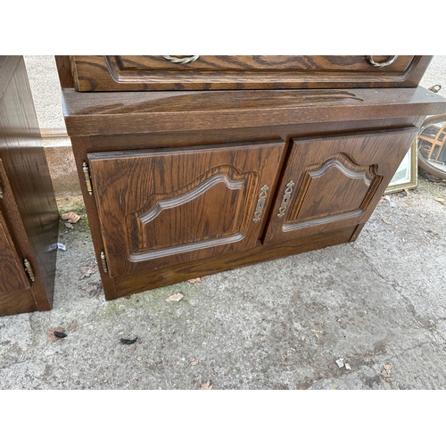 3064 - AN OAK CABINET WITH GLAZED AND LEADED UPPER PORTION, 37