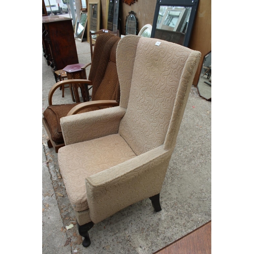 3110 - AN ART DECO STYLE ROCKING CHAIR AND WINGED FIRESIDE CHAIR ON CABRIOLE LEGS