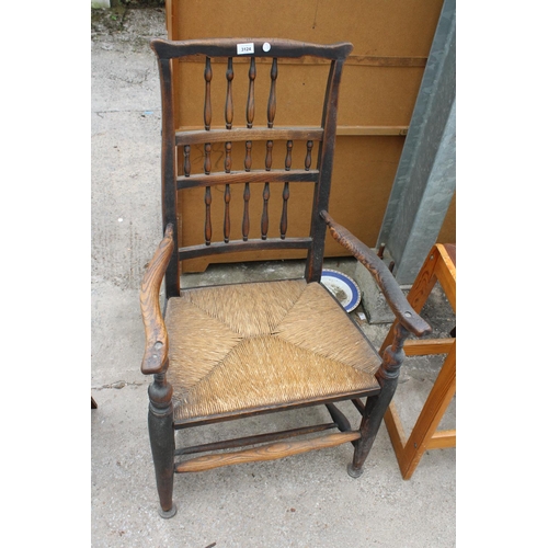 3124 - AN 18TH CENTURY ELM SPINDLE BACK ELBOW CHAIR