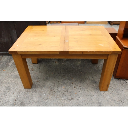 3127 - A MODERN OAK EXTENDING DINING TABLE 55