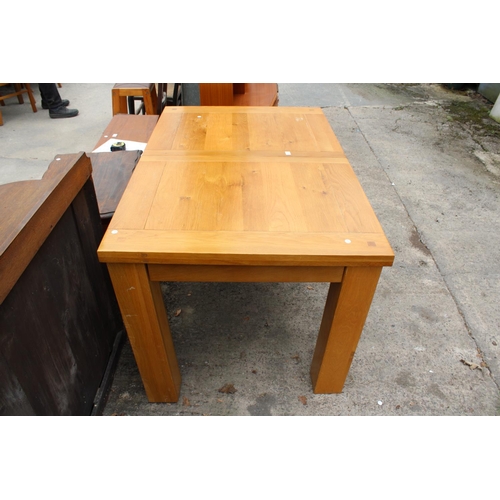 3127 - A MODERN OAK EXTENDING DINING TABLE 55