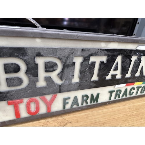 375A - AN ILLUMINATED BRITAINS TOY FARM TRACTORS SIGN (L:68CM H:25CM)