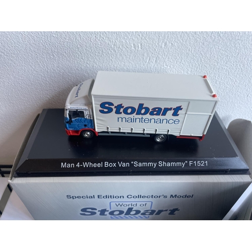 381 - FOUR BOXED STOBART VEHICLES TO INCLUDE A UNIMOG, FIRE ENGINE AND TWO WAGONS THREE WITH COA