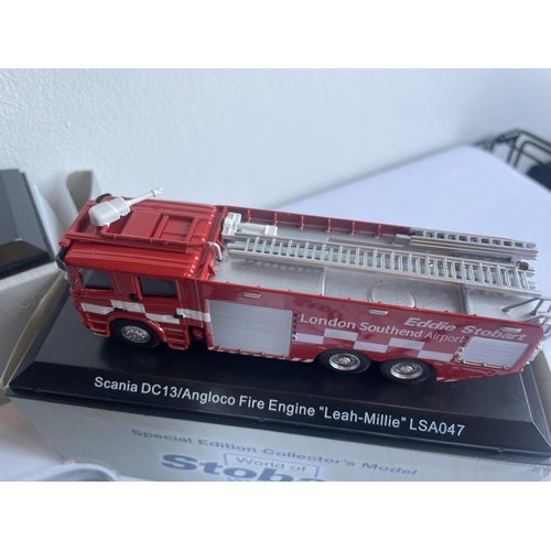 381 - FOUR BOXED STOBART VEHICLES TO INCLUDE A UNIMOG, FIRE ENGINE AND TWO WAGONS THREE WITH COA