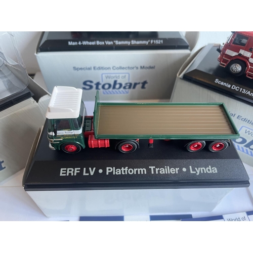 381 - FOUR BOXED STOBART VEHICLES TO INCLUDE A UNIMOG, FIRE ENGINE AND TWO WAGONS THREE WITH COA