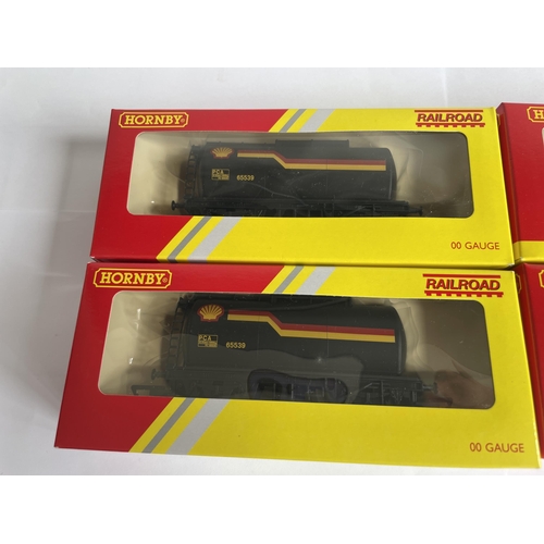 438 - FOUR BOXED HORNBY 00 GAUGE FREIGHT CARRIAGES TO INCLUDE THREE SHELL TANKERS AND A PLANK WAGON