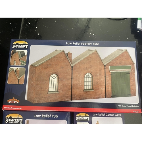 443 - THREE OO GAUGE SCENECRAFT BY BACHMANN MODEL BUILDINGS TO INCLUDE A LOW RELIEF FACTORY SIDE, PUB AND ... 