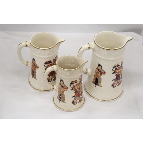 102 - A SET OF THREE ORIENTAL STYLE JUGS - ALL WITH STAMPS TO BASE