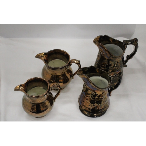 107 - FOUR ANTIQUE COPPERWARE LUSTREWARE JUGS