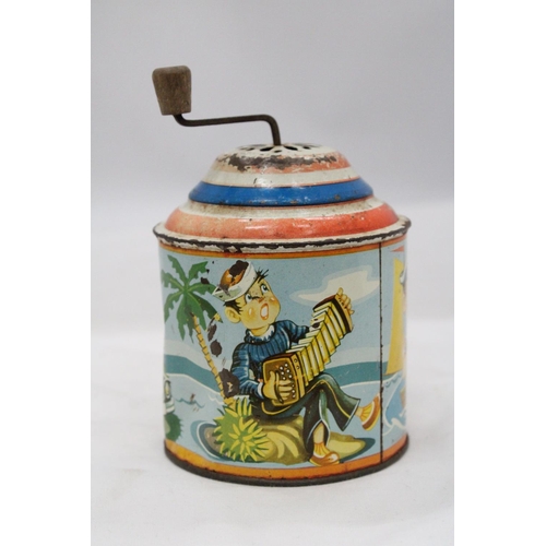 130 - A 1950'S GERMAN TIN PLATE MUSIC BOX IN WORKING ORDER AT TIME OF CATALOGUING