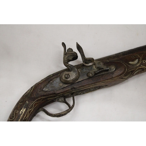 141 - A VINTAGE PISTOL WITH MOTHER OF PEARL AND BRASS INLAY