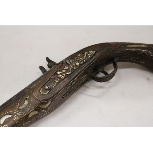 141 - A VINTAGE PISTOL WITH MOTHER OF PEARL AND BRASS INLAY