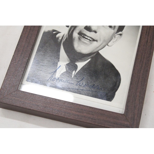 150 - A SIGNED AND FRAMED NORMAN WISDOM PHOTOGRAPH