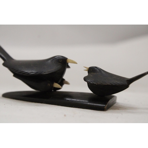 151 - TWO TRIBAL ART CARVED BIRDS